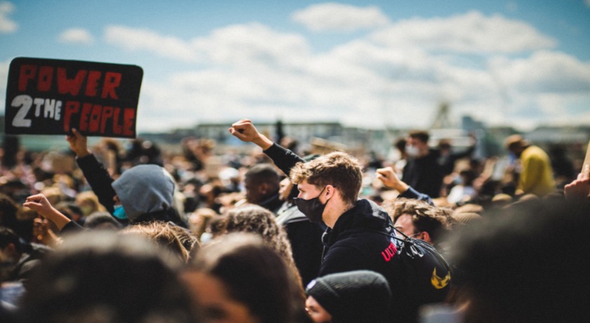 People protesting. Credit Mika Baumeister/Unsplash