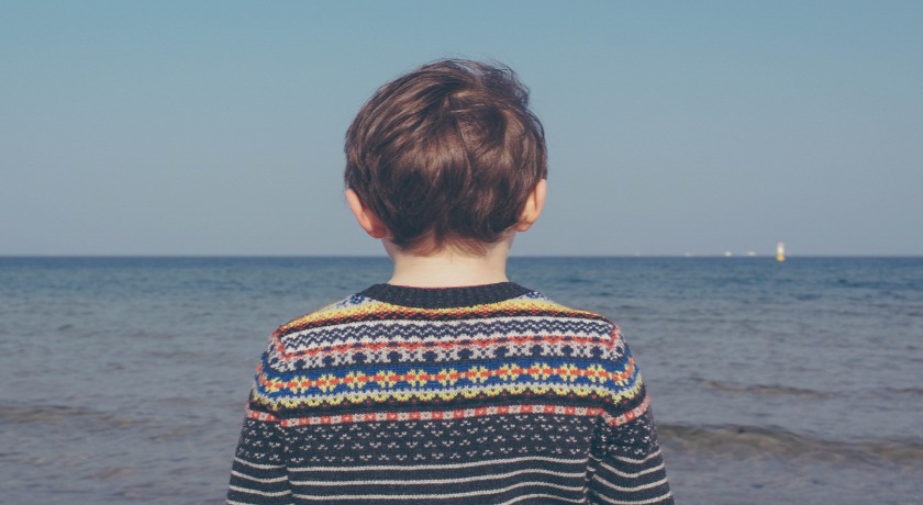 Boy by the sea credit Michal Parzuchow/Unsplash